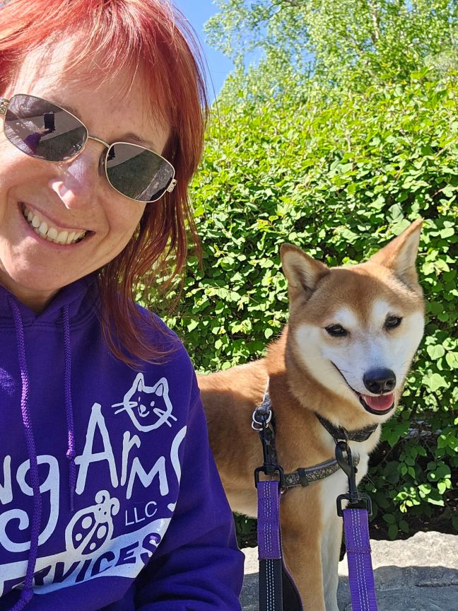 Adult female and smiling Shiba Inu